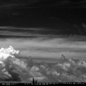 two silhouettes on skyline