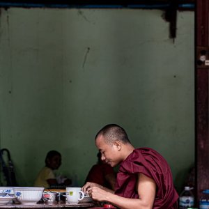 Buddhist monk having breakfast