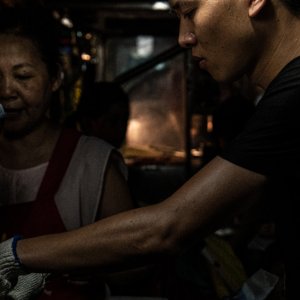 Young man working in Linjiang Night Market