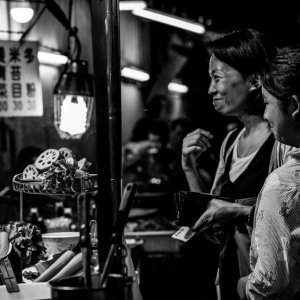 Woman buying with a large grin