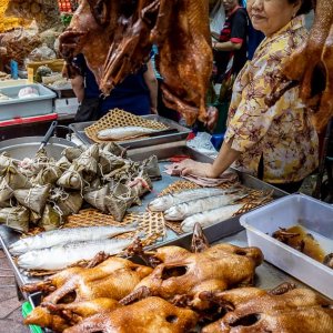 Roasted chickens, fishes, and Zongzi on display at the store