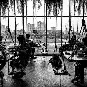 Silhoutted people having lunch in JJ Mall