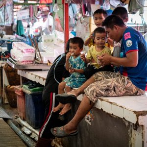 Family relaxing in Khlong Toei Market