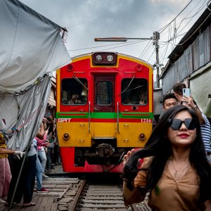 Tourists excited about the train in Maeklong Railway Market