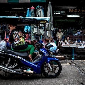 Woman sitting on a Honda motorbike