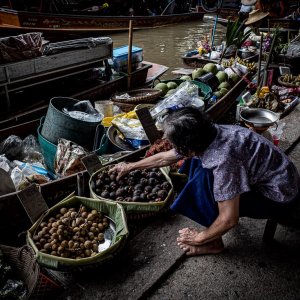 Woman reaching her hand for mangosteen