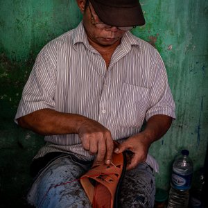 Shoe repairman in Glodok district