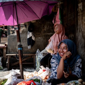 Woman with a hijab working in grocery in Glodok, Jakarta
