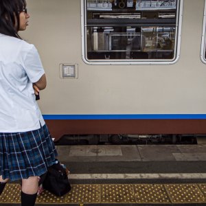 high school girl standing on platform