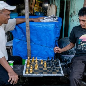 Men playing chess in the residential area