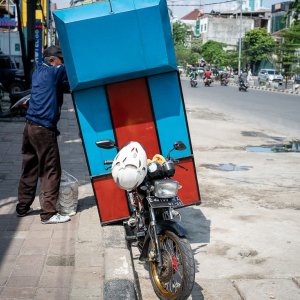 Motorcycle with a large box attached to the rear
