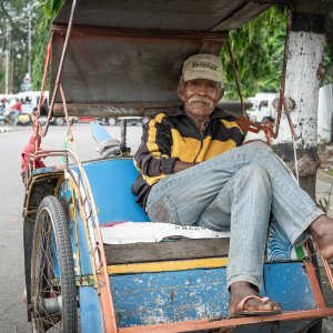 Elderly Becak driver