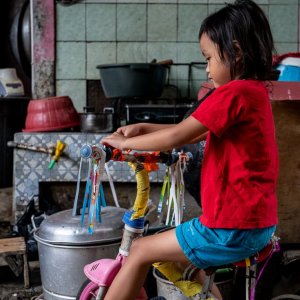 Girl on a fluttering tricycle