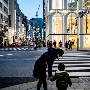 Parent and child walking through Ginza