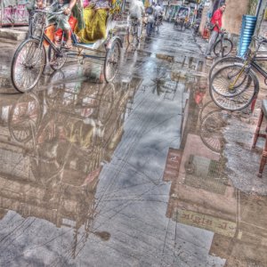 CYcle rickshaw in puddle