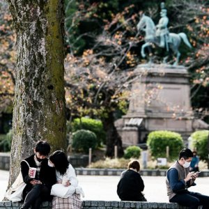 Couple relaxing in Ueno Park