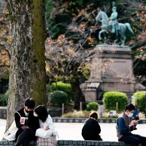 Couple relaxing in Ueno Park
