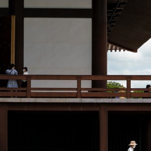 Man walking by the main hall of Naritasan Shinsho-ji Temple