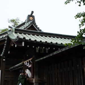 Shinto priest taking out a staff