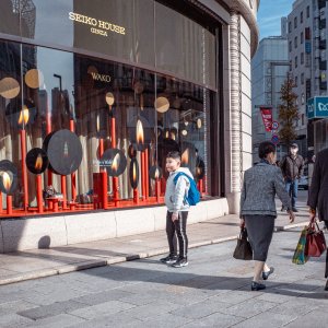 Boy standing in front of Ginza Wako