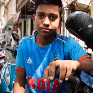 Young man in India's national cricket uniform