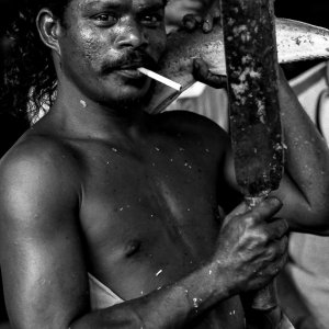 Man striking pose while smoking