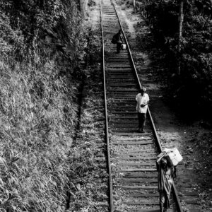 People walking on railway track