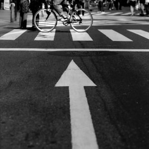 Bicycle running ahead arrow