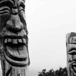Wooden statues smiling