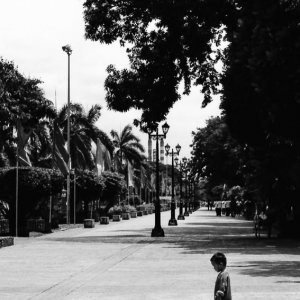 Little boy standing alone in Rizal Park