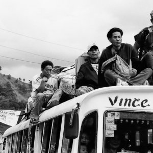 Passengers on the roof of a bus