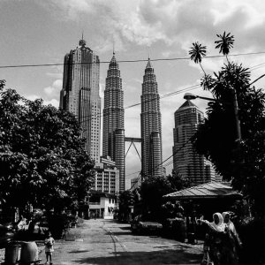 Petronas Twin Towers at end of street
