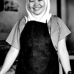 Smiling girl wearing apron