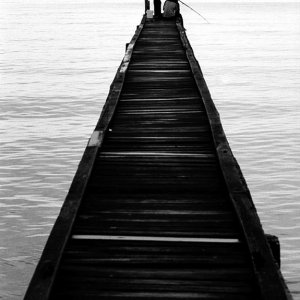 Boys fishing on the edge of pier