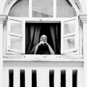 Buddhist monk by window