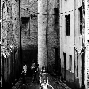 Kids playing in dim alley