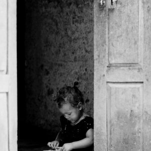 Little girl playing alone