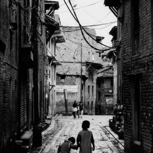 Brothers walking down a dimly lit alley
