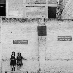 Girls leaning against wall