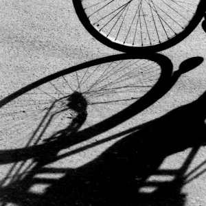 Silhouette and shadow of cycle rickshaw wheel