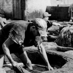 Man working in tanning pit