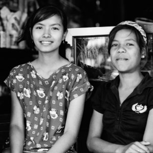 Two girls working at a bicycle shop