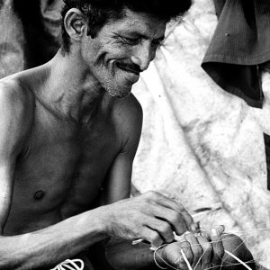 Man repairing fishnet