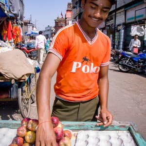 Young man selling apples