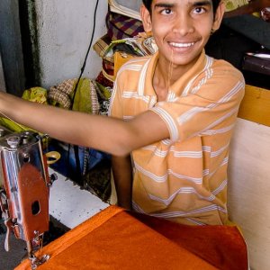 Boy sewing