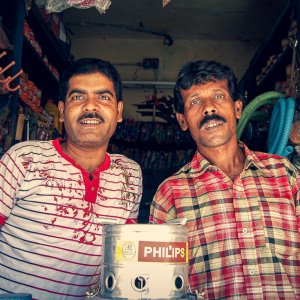 Two men in small shop