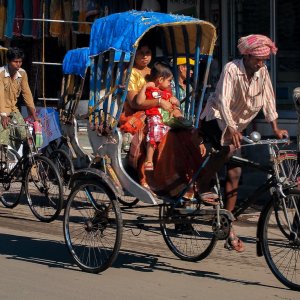 Mother and baby on cycle rickshaw