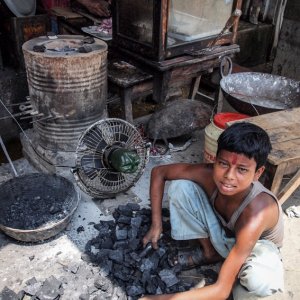Boy selling coals