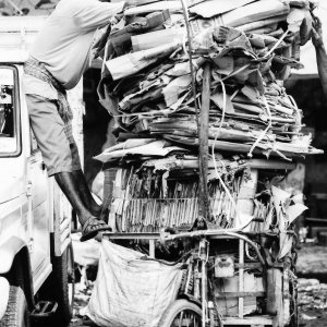 Overloaded tricycle with cardboards