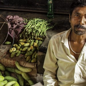 Man selling cucumbers